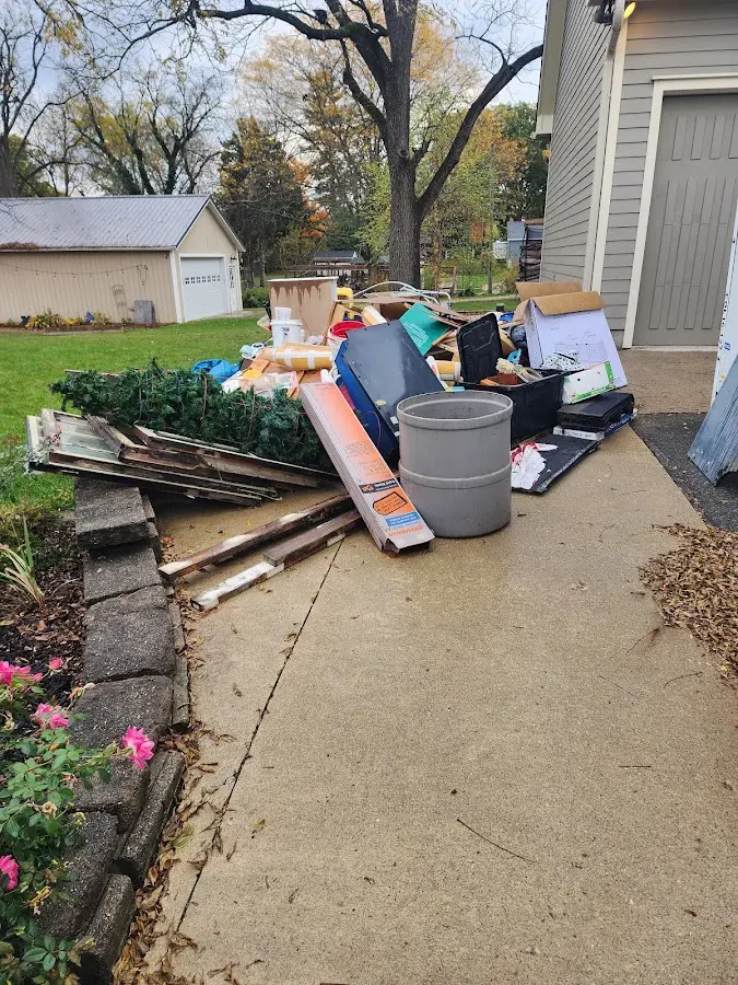 Dumpster being loaded with debris for Commercial Dumpster Rental in Janesville